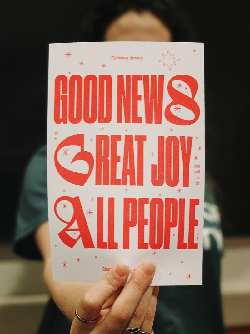 worship, red, alphabet, banner, real people, 2K, news, paper, symbol, lifestyles, advent, word, good, holding, focus on foreground, close-up, christmas