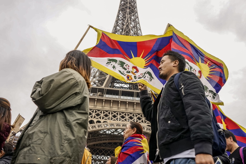 men, standing, tower, text, human, protest, flag, wearing, outdoors, eiffel tower, paris, adult, togetherness, france, architecture, people, waist up, shorts