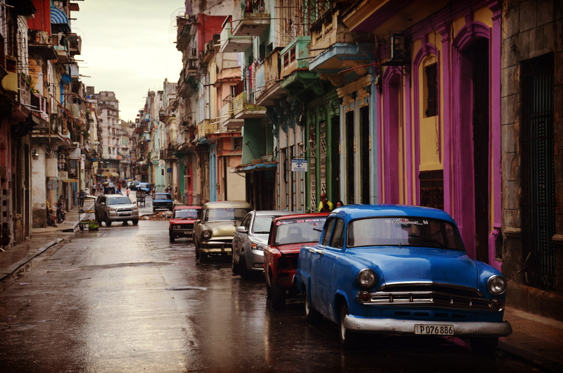 city, colourful houses, building, road, city street, parked, motor vehicle, wet, vintage car, residential district, buildings, cars, car, building exterior