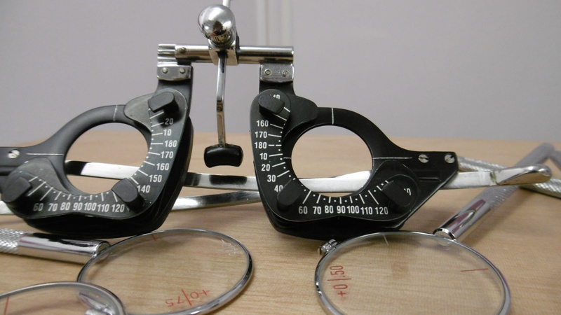 indoors, table, glasses, eyesight, 1080P, metal, visual, time, eye test, vision, equipment, technology, close-up, number, nostalgia, circle, geometric shape