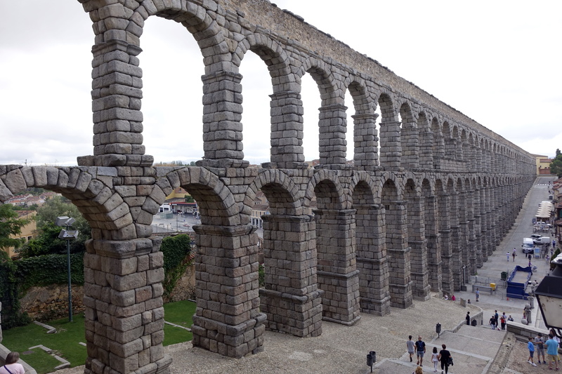 travel destinations, old ruin, nature, archaeology, group of people, sky, aqueduct, large group of people, architecture, outdoors, aqueduct of segovia