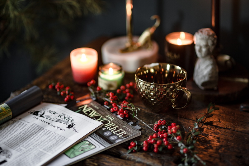 religion, gold cup, newspapers, fire, notebook, cup, table, publication, fresh coconut, tea light, magazine, fruit, selective focus, spirituality, fresh