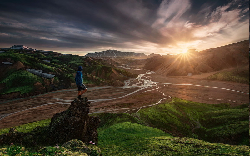 activity, scenics - nature, river, tranquility, cloud - sky, rock - object, one person, tranquil scene, environment, beauty in nature, full length, lens flare