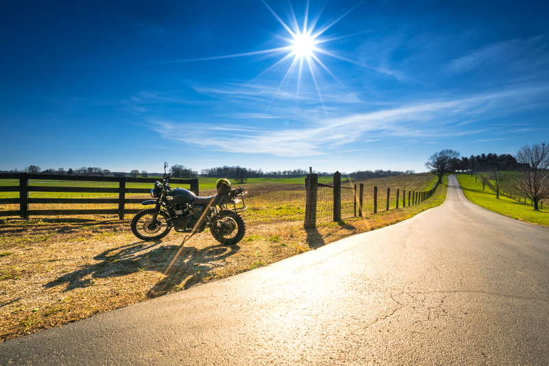 mode of transportation, field, landscape, near, bicycle, diminishing perspective, lens flare, transportation, scrambler, single lane road, road, sunny