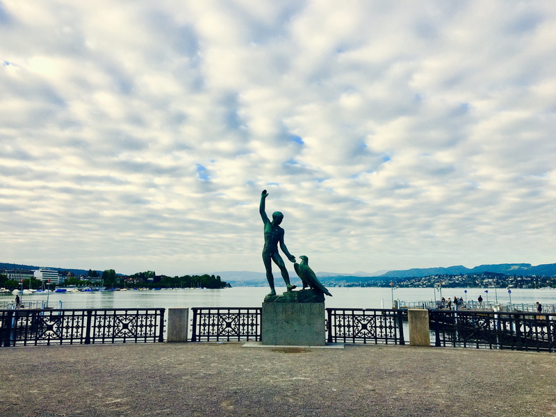 architecture, paddle steamer, placed lake, mountains, art and craft, spring, built structure, promenade, outdoors, cloud - sky, steamboat, sea, nature