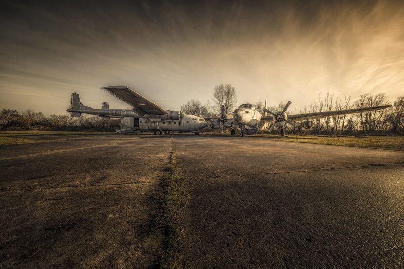 aircraft, environment, field, day, building exterior, airport, mode of transportation, 1080P, airplane, outdoors, no people, landscape, built structure