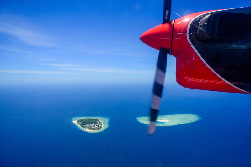 adventure, no people, ocean, flying, clouds, aircraft, air, motion, mode of transportation, red, vehicle, maldives, black, flight, white, horizon, daylight