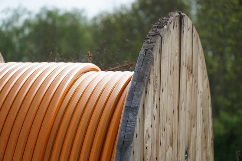 role, 5K, focus on foreground, wood, field, barrel, nature, cable reel, pattern, plant, civil engineering, close-up, outdoors, orange, tranquility, textile