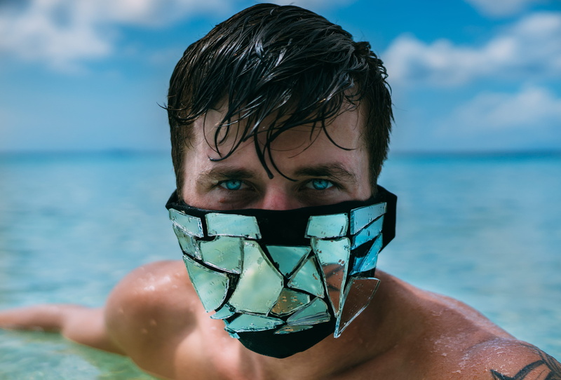 male, shirtless, person, looking at camera, boy model, accessory, day, headband, sunglasses, hat, real people, sea, nature, water, apparel, blue eyes, clear