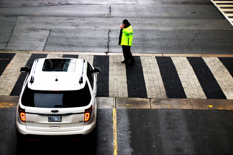 full length, street, directing traffic, streets, dark, men, real people, one person, ford, high angle view, 2K, reflective clothing, traffic, city, transportation