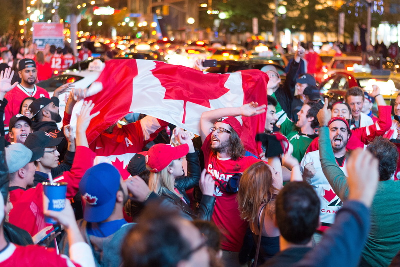 patriotism, excitement, canada, fan - enthusiast, city, toronto, togetherness, lifestyles, hockey, sport, outdoors, large group of people, adult, men, unity