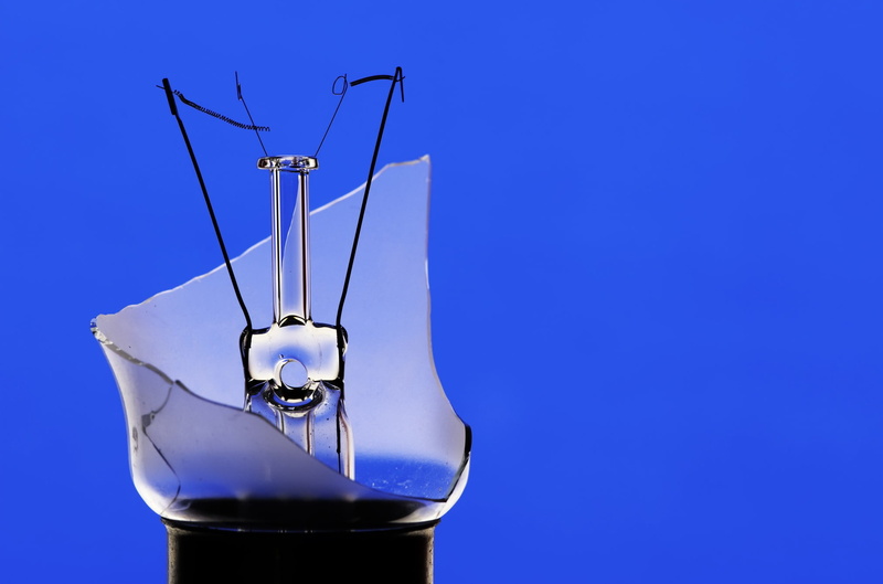 broken glass, lightbulb, transparent, cut out, studio shot, household equipment, glass, still life, no people, blue, metal, colored background, close-up