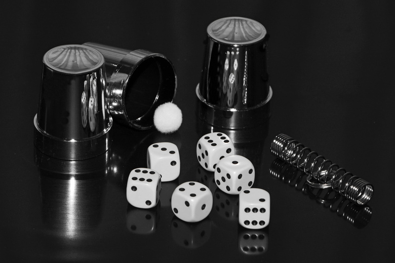 six, luck, table, close-up, toys, arts culture and entertainment, cube, group of objects, gambling, black and white, secret, conjure, magic trick, indoors