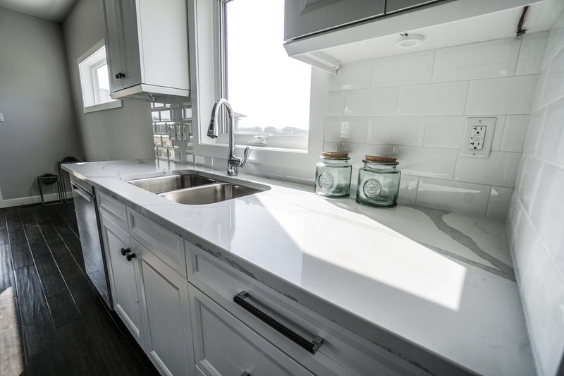 sink, no people, architecture, bathroom, furniture, counter top, counter, absence, luxury, granite, clean, cabinet, home showcase interior, steel, day