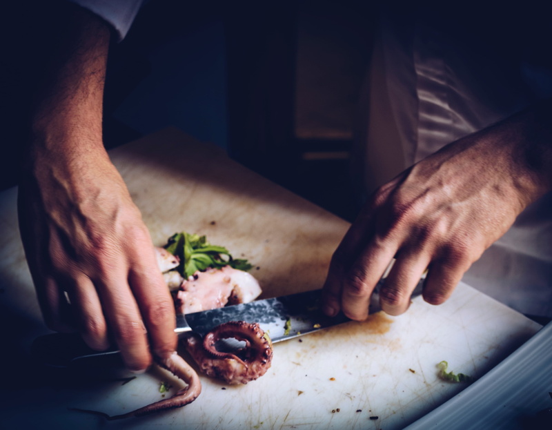 cutting board, close-up, person, squid, hands, 2K, midsection, hand, one person, cooking, knife, men, slicing, human hand, healthy eating, tentacle, human body part