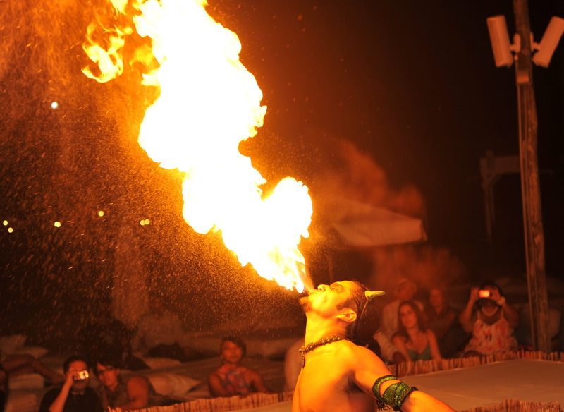 man, ward off witches, fire - natural phenomenon, ceremony, watching, occupation, adult, stunts, flame, native, dancer, fakir skills, stage, group of people