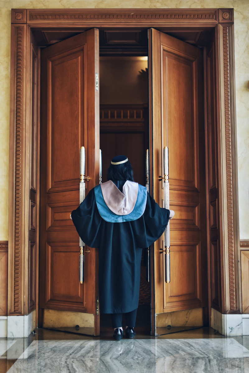 door, success, real people, one person, day, lifestyles, obscured face, degree, graduate, clothing, leisure activity, graduation, disguise, built structure
