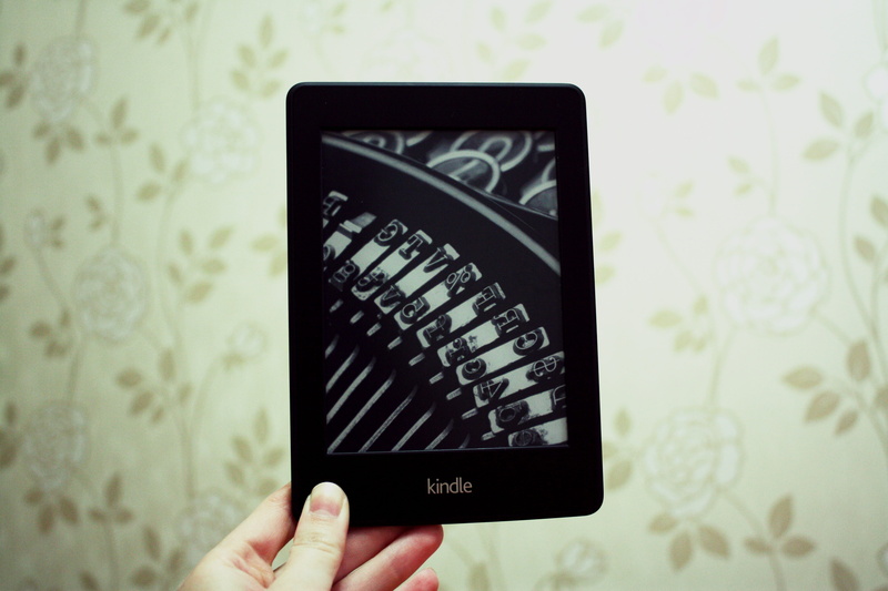 one person, reader, device, kindle, display, holding, touchscreen, person, e-reader, adult, electronic book, literature, floral pattern, information