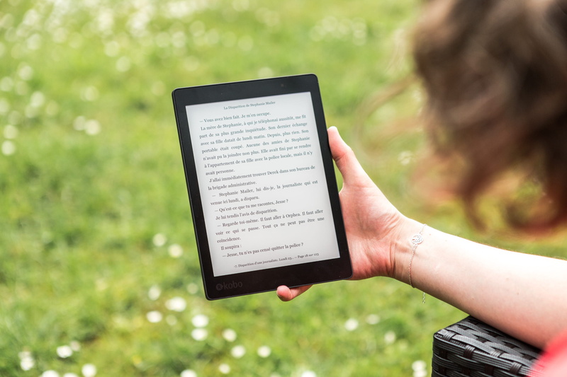 lifestyles, landscape, electronics, person, bookworm, activity, human hand, book, portable, reading, selective focus, reader, e-reader, grass, turned, relaxation