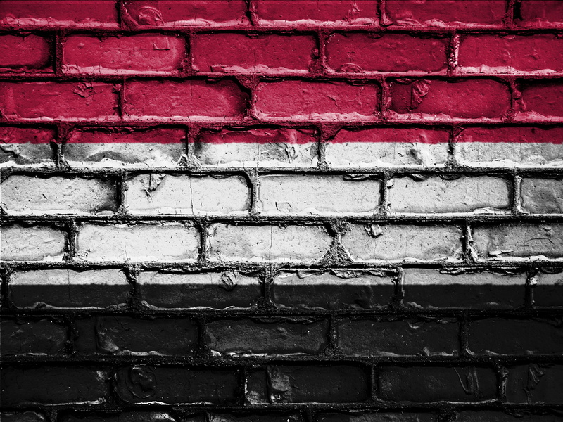 banner, close-up, built structure, pattern, outdoors, nation, brick wall, yemen, emblem, graffiti, flag, no people, art and craft, building exterior, red