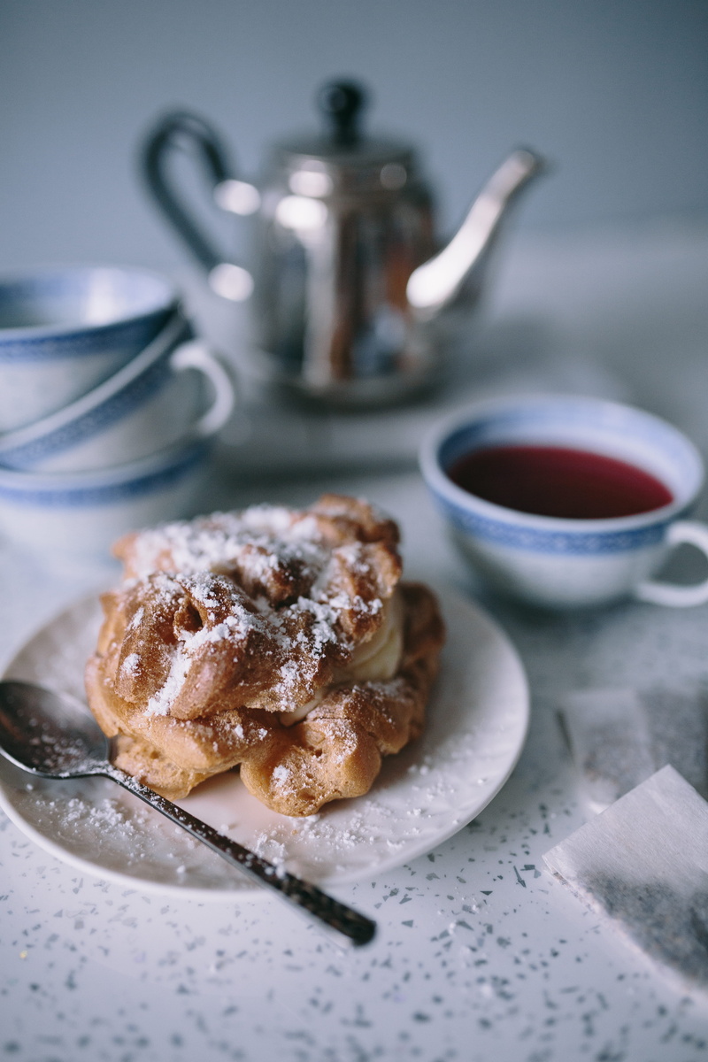 table, high angle view, puffs, breakfast, cream, gourmet, still life, cookie, close-up, plate, sugar, kitchen utensil, food and drink, refreshment, indulgence