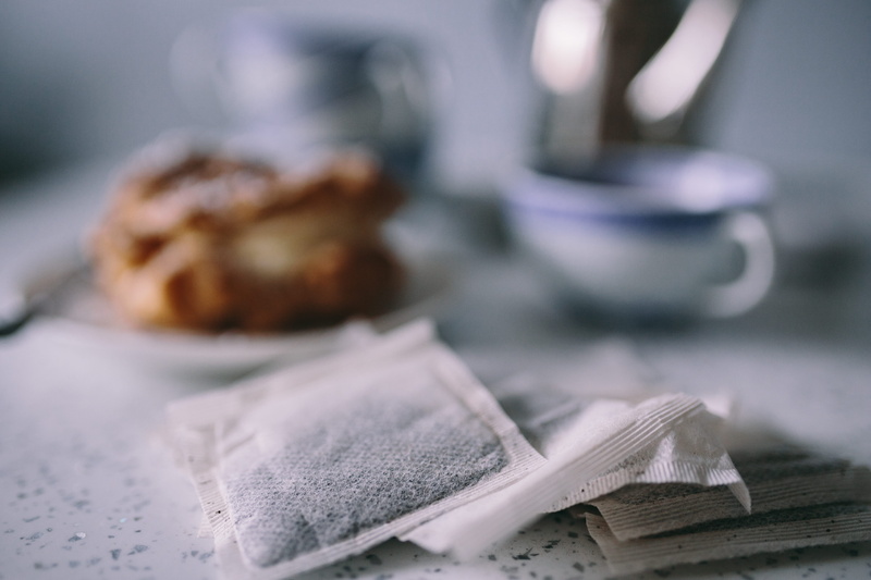 food and drink, puffs, breakfast, paper, the media, indoors, french food, Cream Puffs, textile, close-up, cookie, still life, tea - hot drink, cup of tea