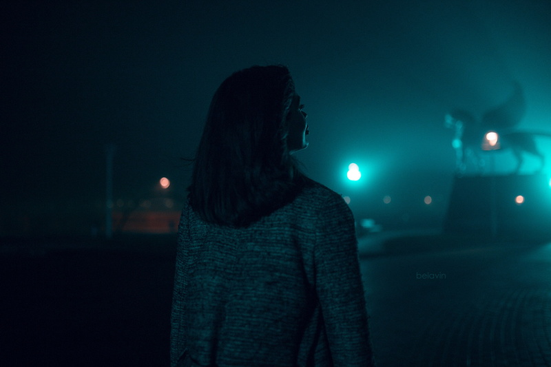city, warm clothing, cityscape, model, sweater, lifestyles, standing, depth of field, women, looking into the distance, illuminated, brunette, night, waist up