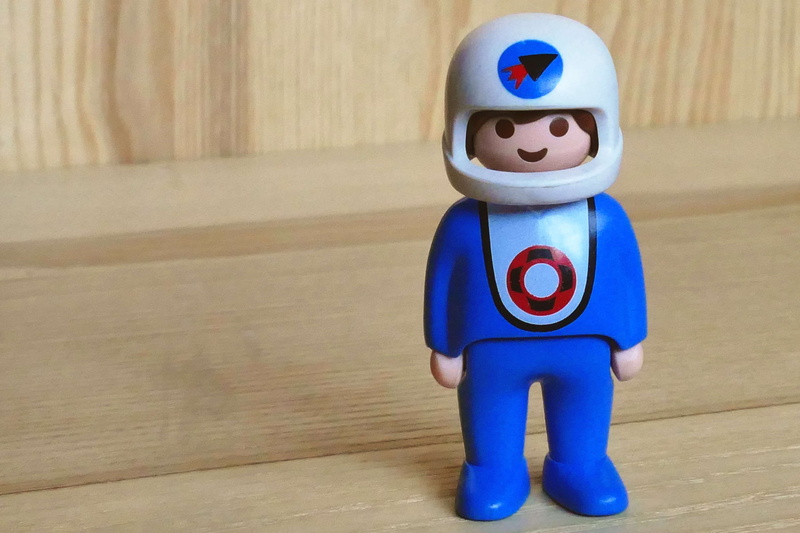 table, human representation, space suit, close-up, male likeness, man, representation, indoors, minifigure, figurine, action figure, blue, wood - material