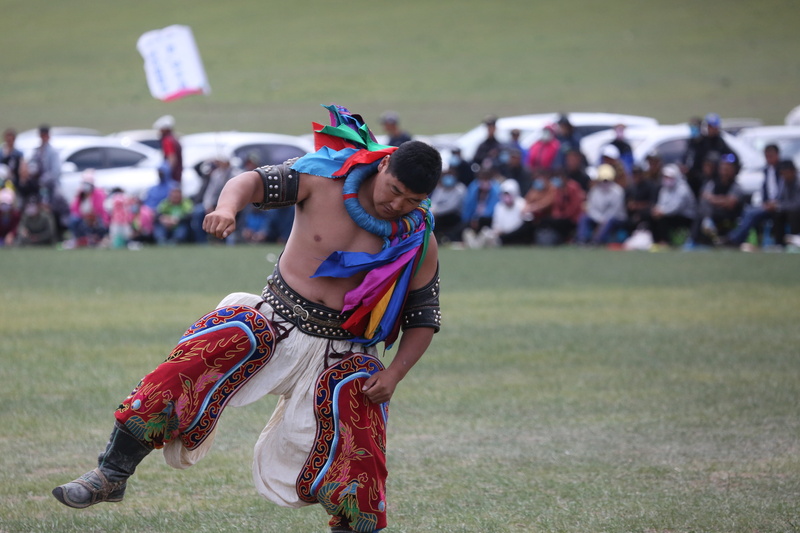 looking, mongolian, festival, men, field, sports, arts culture and entertainment, costume, wrestle, day, group of people, women, focus on foreground, leisure activity
