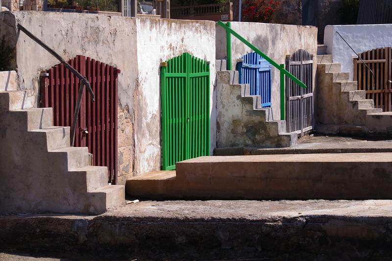 architecture, sunlight, staircase, port, day, built structure, outdoors, multi colored, house, sunny, stairs, building, railing, wall - building feature