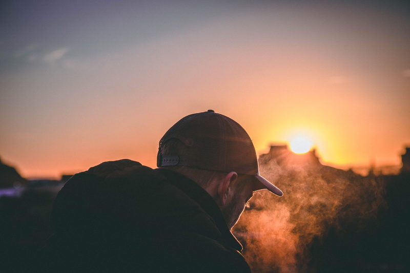 rear view, orange color, lens flare, outdoors, clothing, men, hour, sky, 4K, person, cap, one person, golden, adult, apparel, silhouette, sunlight, lifestyles