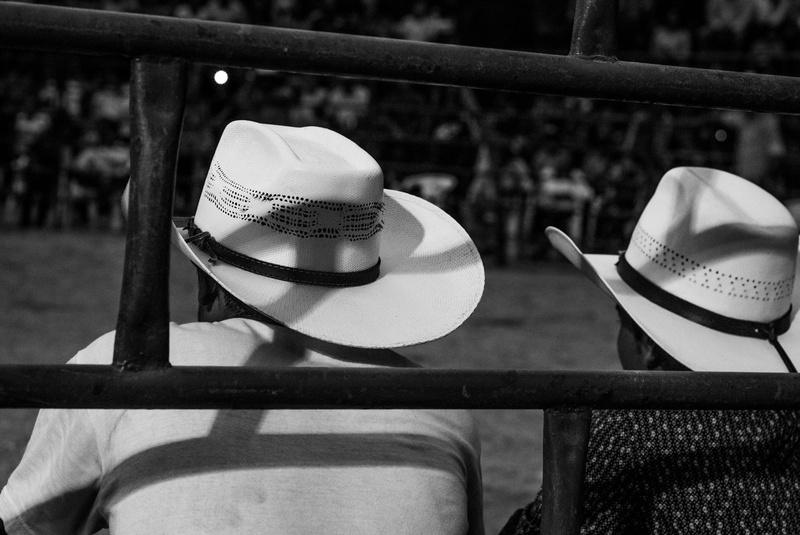 cowboy hat, fence, safety, table, apparel, handrail, harmonica, no people, human, sun hat, barrier, protection, still life, hat, banister, black and white