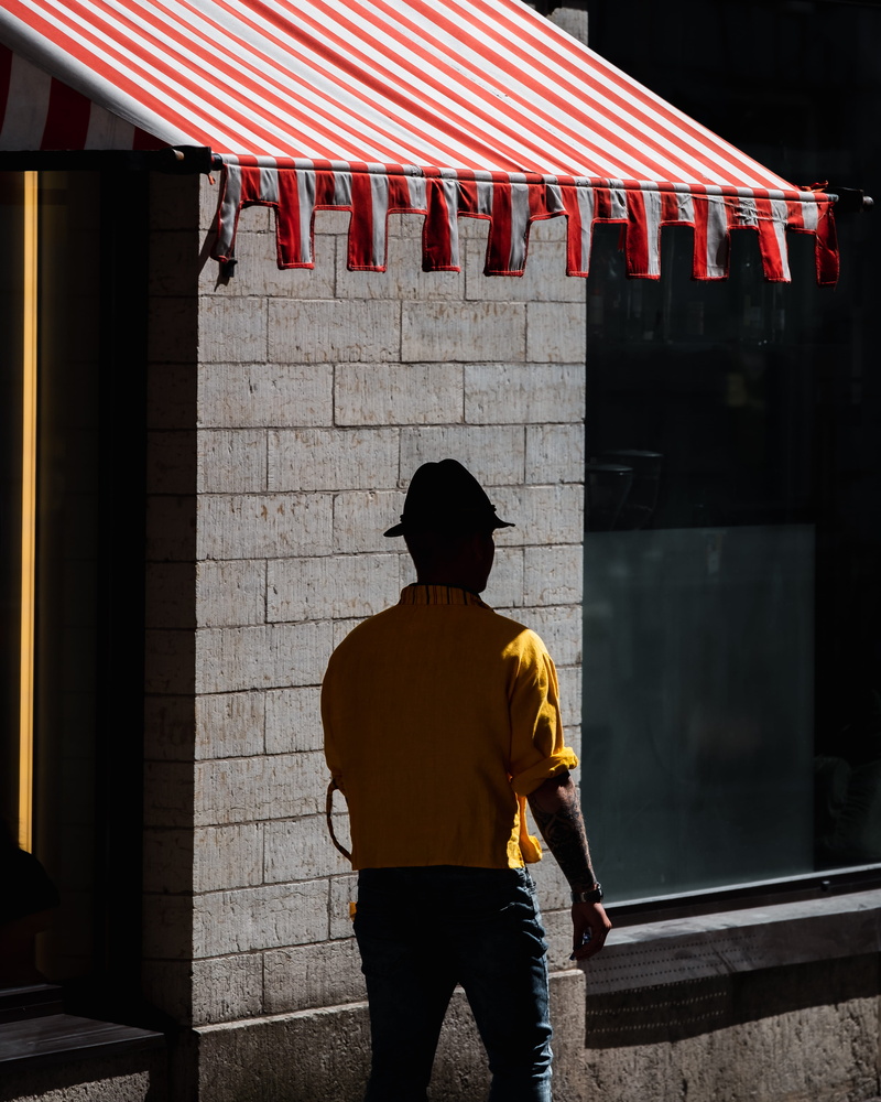 shadow, stone, striped, casual clothing, built structure, standing, walking, top, hat, urban, lifestyles, 4K, wall, architecture, leisure activity, rear view