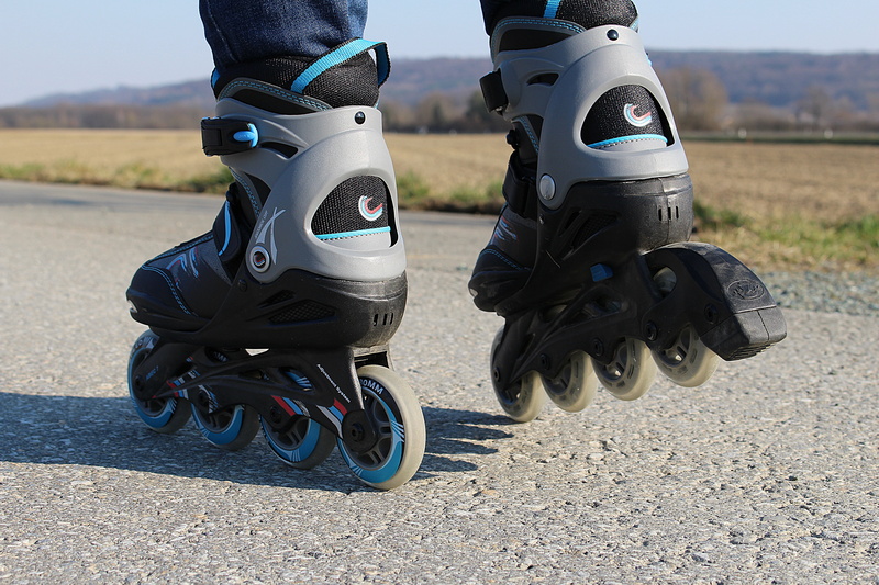 wheel, headwear, sunlight, technology, people, road, rollerskates, outdoors, using, nature, helmet, focus on foreground, leisure, men, bicycle, close-up