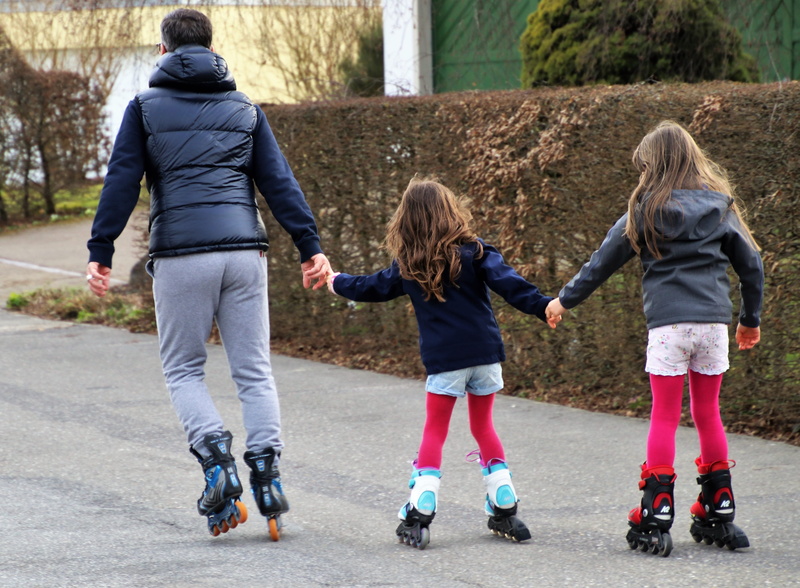 child, girl, fun, family, dad, women, lifestyles, relaxation, rollers, sister, casual clothing, sibling, total, recreation, sports, execution, childhood