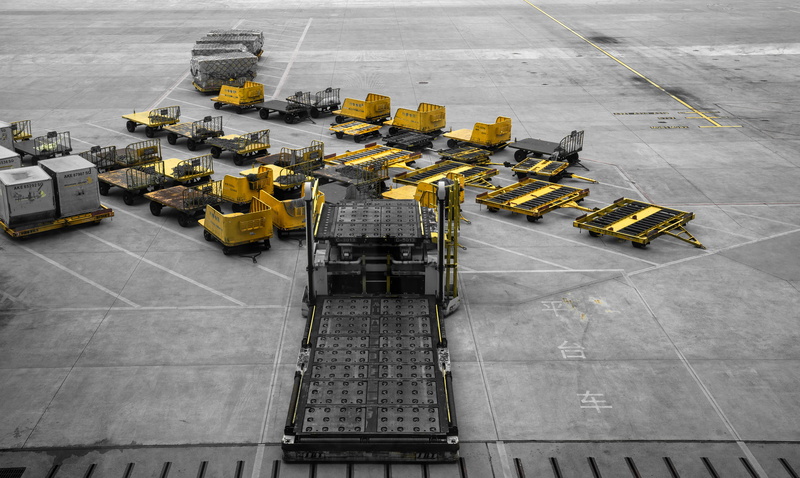 automobile, sign, industry, freight transportation, tarmac, high angle view, sports car, equipments, taxi, architecture, building, in a row, asphalt, no people