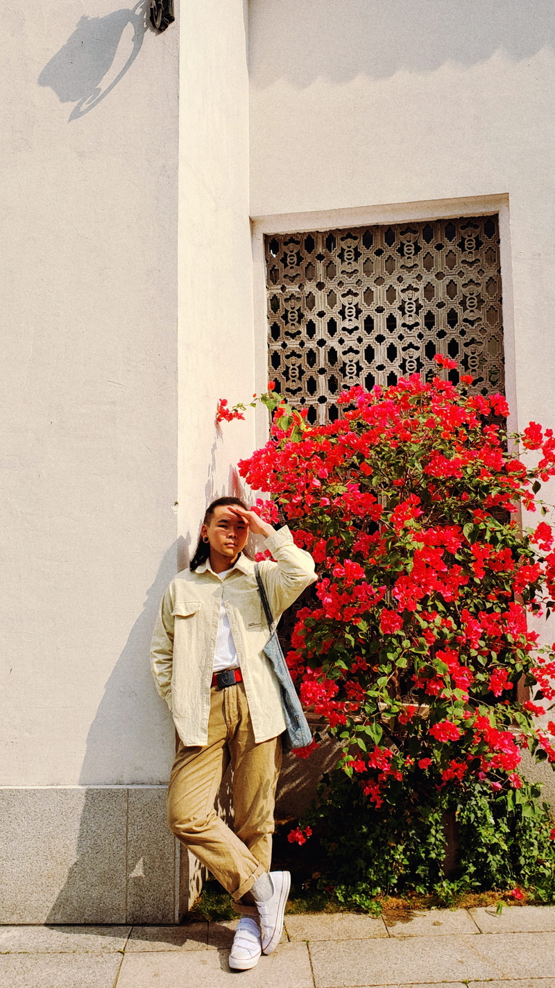 full length, outdoors, overcoat, flower, china, woman, human, one person, you cheng shi za dian, clothing, nature, female, wall - building feature, person