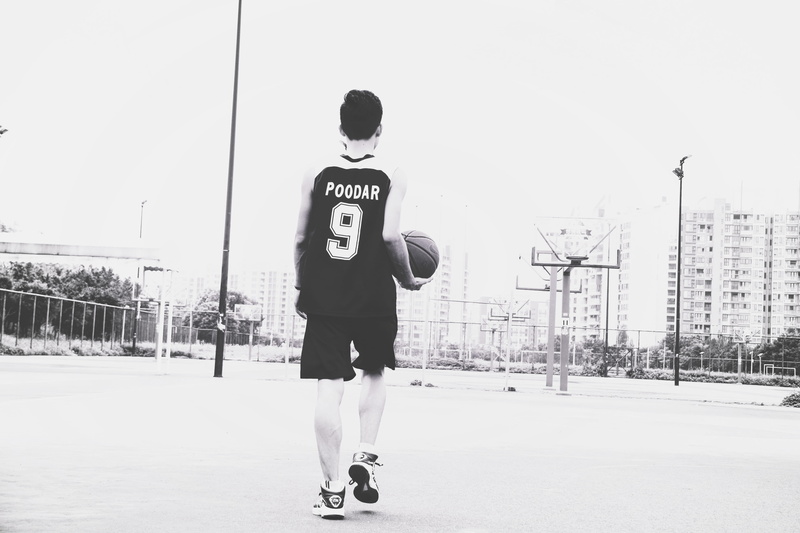 basketball, child, 5K, building exterior, nine, one person, sport, guangzhou shi, street, men, nature, rear view, clear sky, standing, sky, day, lifestyles