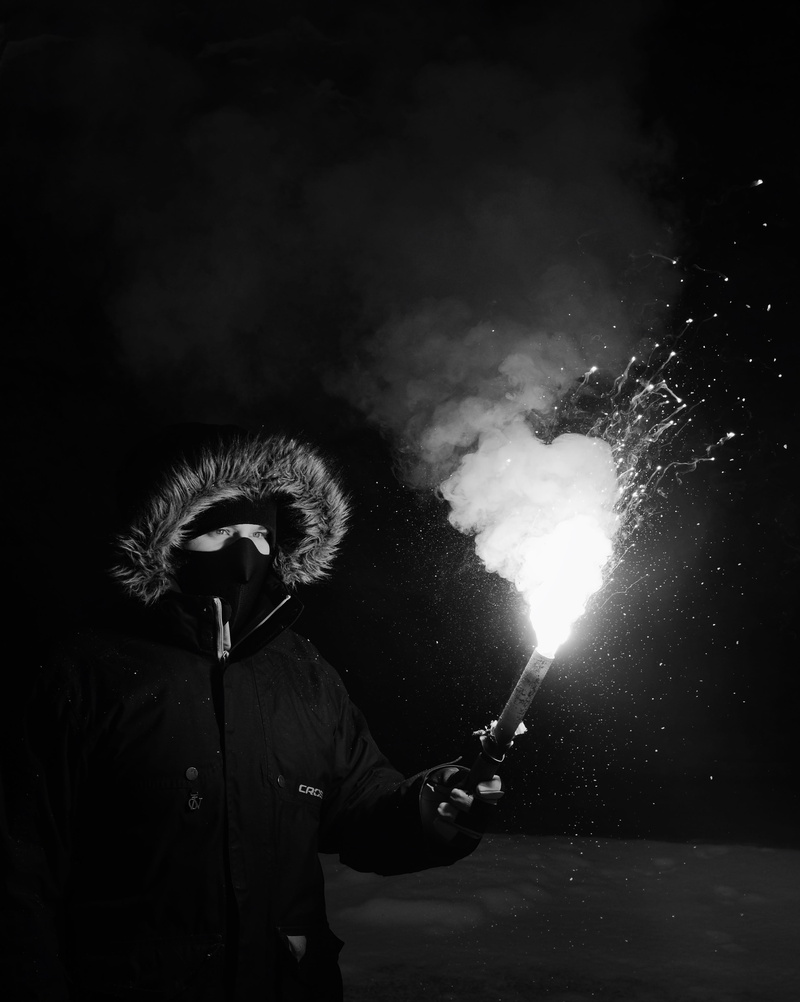 portrait, firework display, men, fire, sparks, rear view, one person, motion, man, real people, mask, coat, wearing, holding, smoke - physical structure