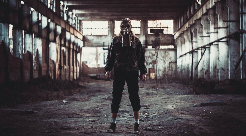 women, front view, focus on foreground, abandoned, mask, 4K, disguise, gas masks, one person, black, casual clothing, jacket, built structure, day, architecture