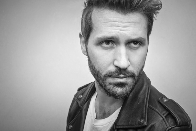 hair, jacket, men, 5K, photoshoot, leather, beautiful people, black leather jacket, indoors, wearing, casual clothing, male, front view, wall, fashion