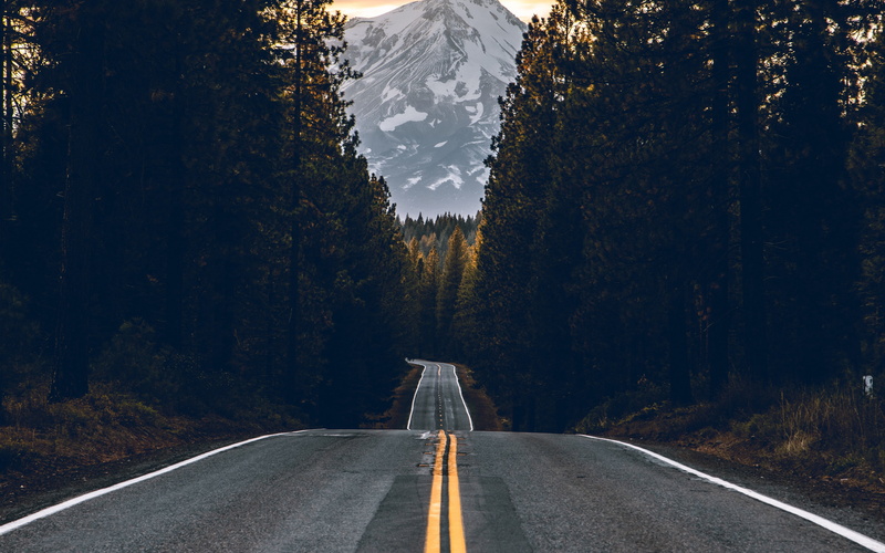 sunbeam, peak, sky, asphalt, road, sunset, trees, snow-covered mountain, 4K, mountain, 4k ultra hd background, landscapes, forest, yellow, nature, view