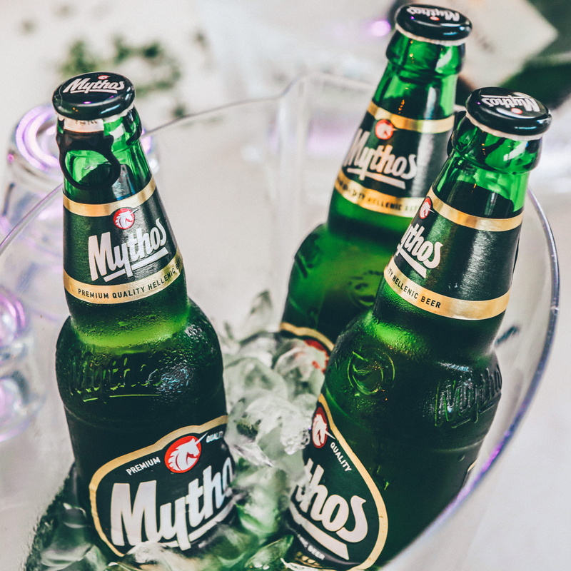 text, cooler, beer bottle, bucket, bar, bottles, high angle view, beer, no people, three, selective focus, still life, mythos, alcohol, green, food and drink