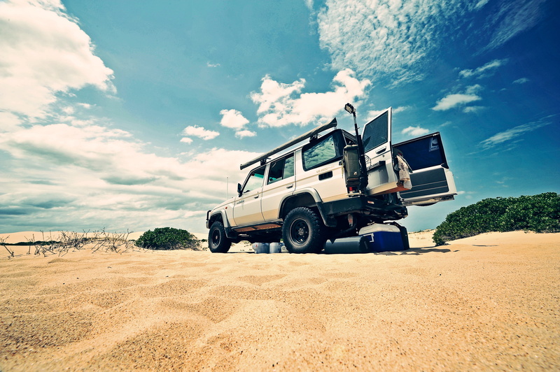 beach, land cruiser, dunes, commercial land vehicle, land, suv, sky, car, off road, road, outdoors, wide angle, offroad, desert, toyota, daytime, camping