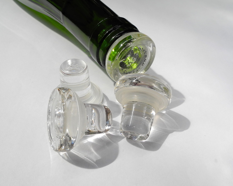 group of objects, wine bottle stopper, no people, close-up, white background, glass - material, studio shot, indoors, winery, container, high angle view