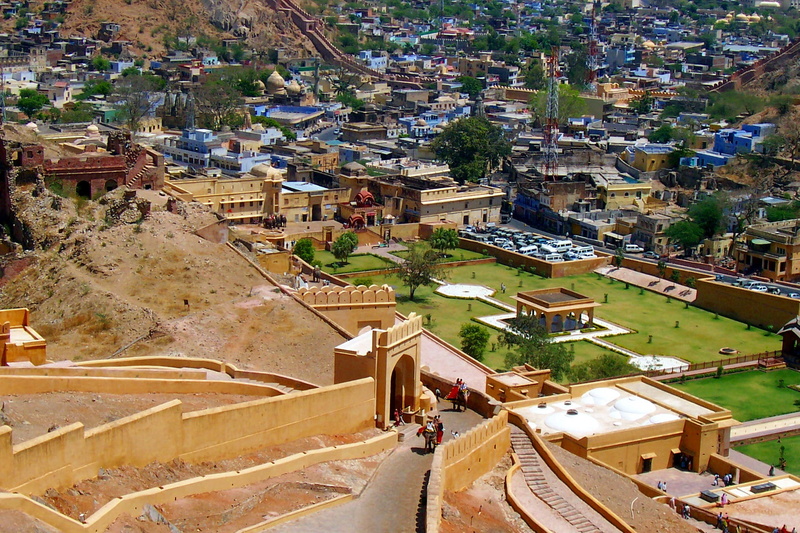 residential district, incidental people, sunlight, elevated road, crowded, amer fort, town, building exterior, cityscape, transportation, townscape, nature