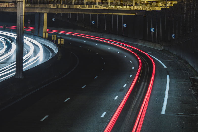 road, built Structure, no People, speed, light, dusk, overpass, business, multiple Lane Highway, city, driving, mode of transportation, tunnel, car, land Vehicle