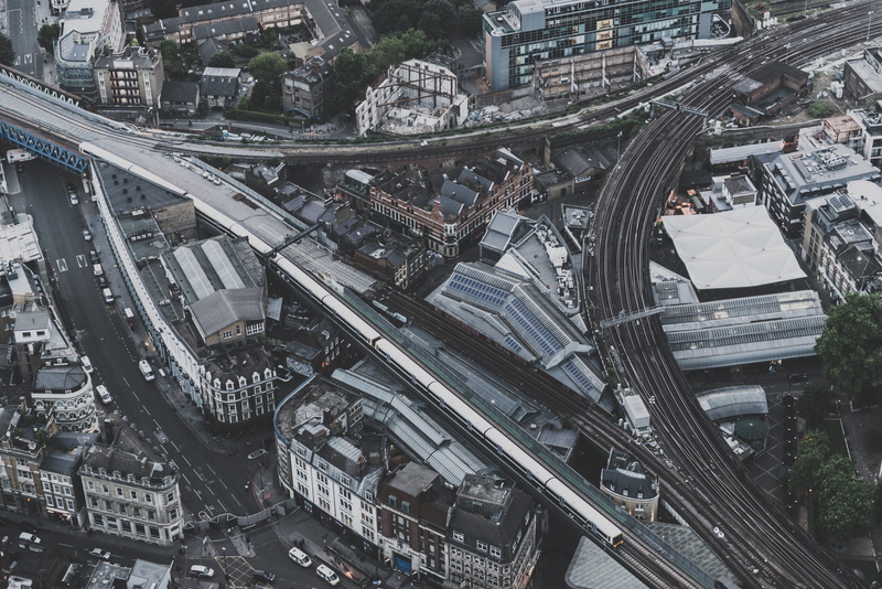 train, cars, day, complexity, daytime, cityscape, building Exterior, high Angle View, outdoors, skyscraper, overpass, mode of transportation, downtown District