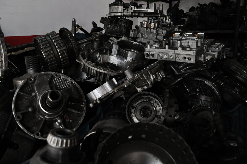 auto parts, mode of transportation, wheel, stack, spare parts, close-up, indoors, industry, metal, machinery, technology, vehicle part, no people, car