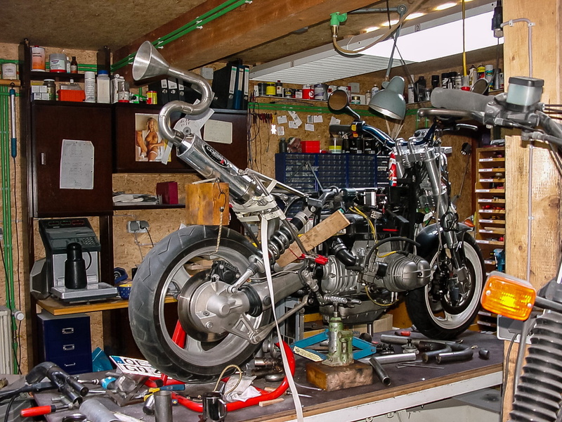 equipment, bicycle, handicraft, wheel, transportation, indoors, work tool, large group of objects, repair shop, land vehicle, garage, motor cycle, repairing